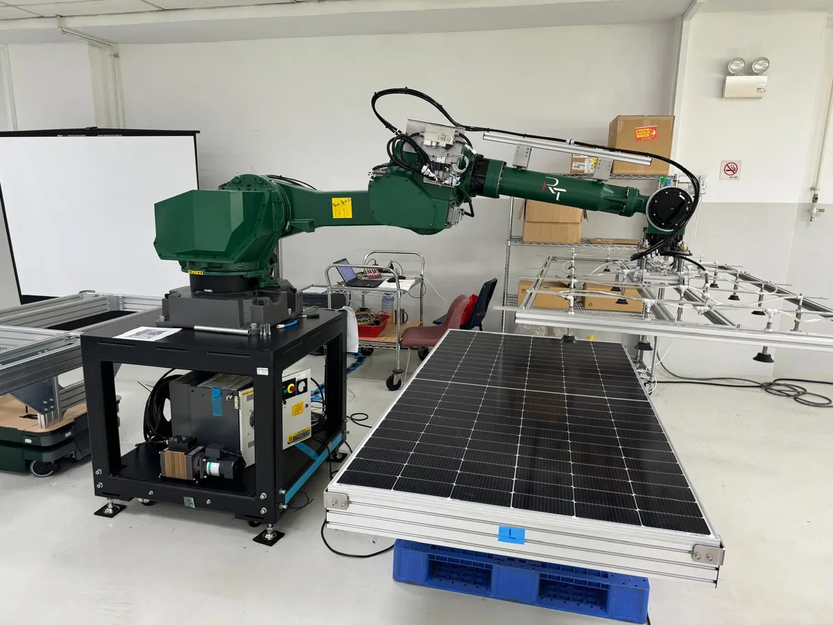 Automated solar panel handling system with FANUC robots